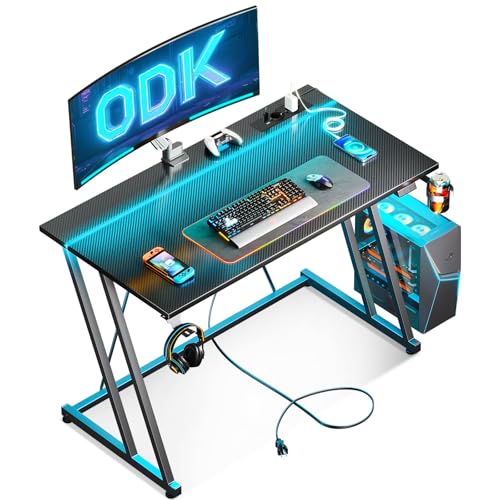 ODK 100 × 50 cm mesa de jogos com luzes LED e tomada de corrente, mesa de jogos com suporte para caneca e gancho para auriculares, design duplo Z mesa computador fibra de carbono preto