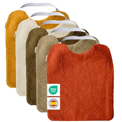 Conjunto de 5 babetes de turco com elástico, para promover a autonomia Laváveis, com interior impermeável e tecido turco de alta qualidade. Babete com gola de borracha. Fabricado em Espanha.